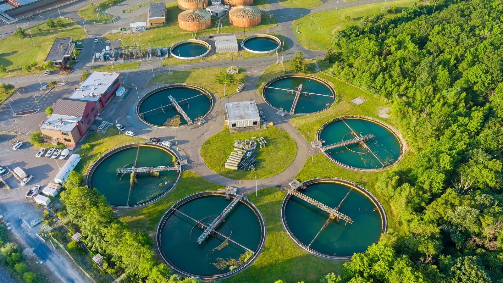 The round settling tanks of a water treatment plant, seen from above